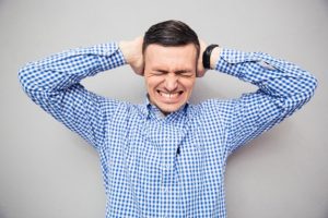 man covering his ears so he doesn't hear bad social media marketing advice