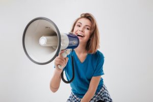 customer with megaphone screaming out what she wants